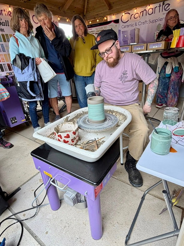 Pottery wheel throwing demonstration on a Cromartie purple wheel at Fired Cornwall 2026