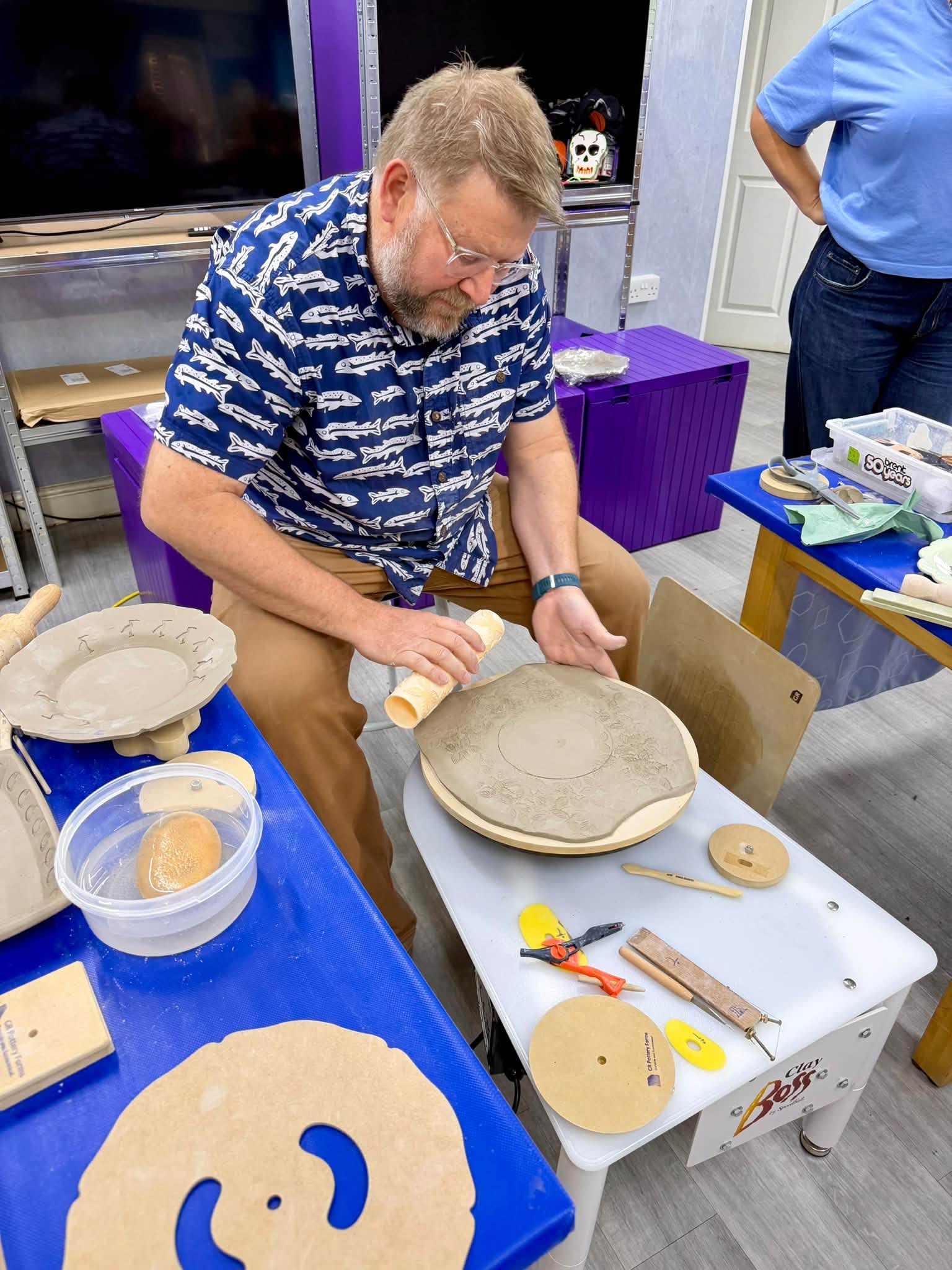 Jeff Rottman working on a clay piece using GR Pottery Forms and a pottery wheel