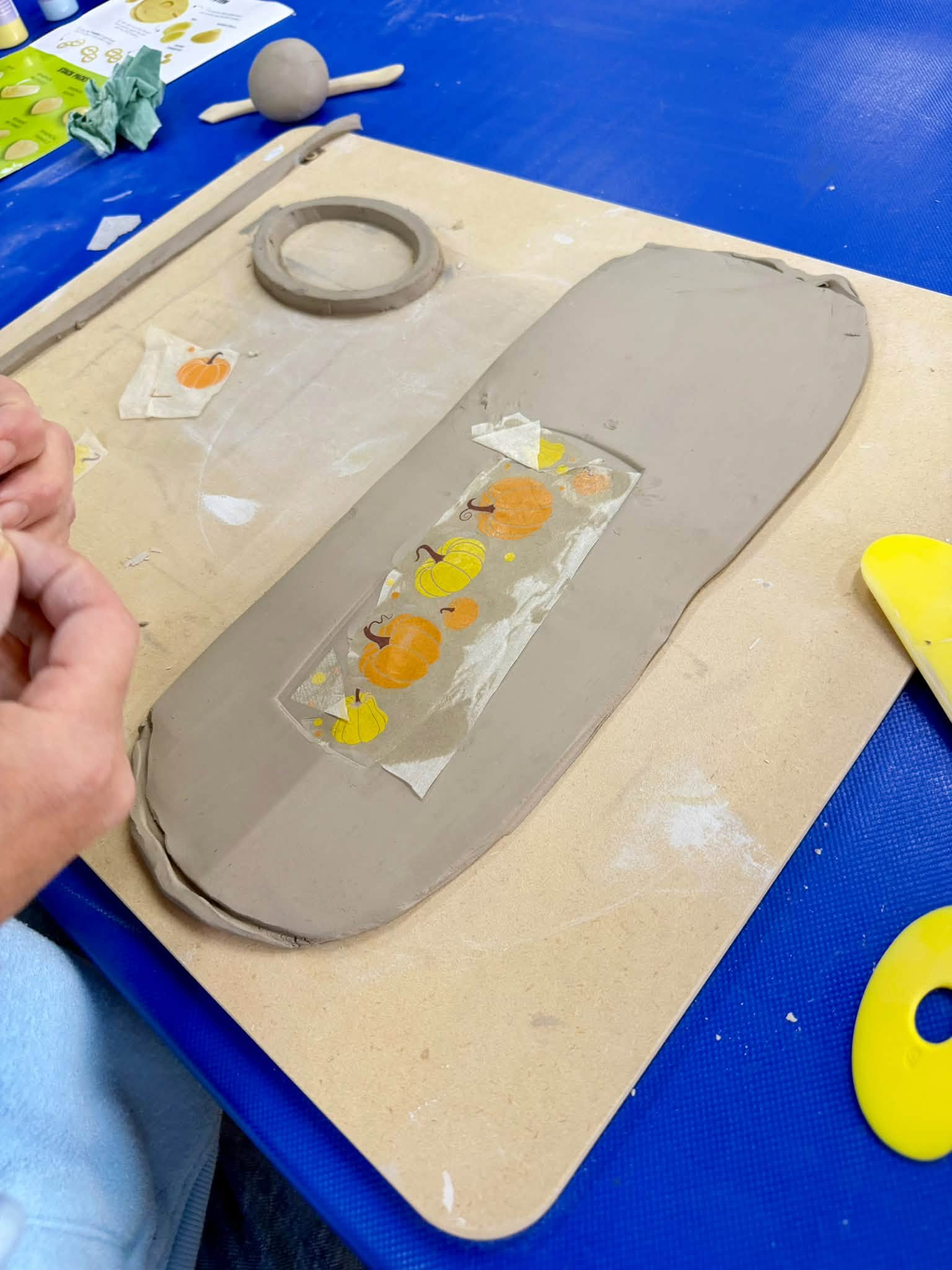 Clay slab decorated with pumpkin impressions during the GR Pottery Forms workshop