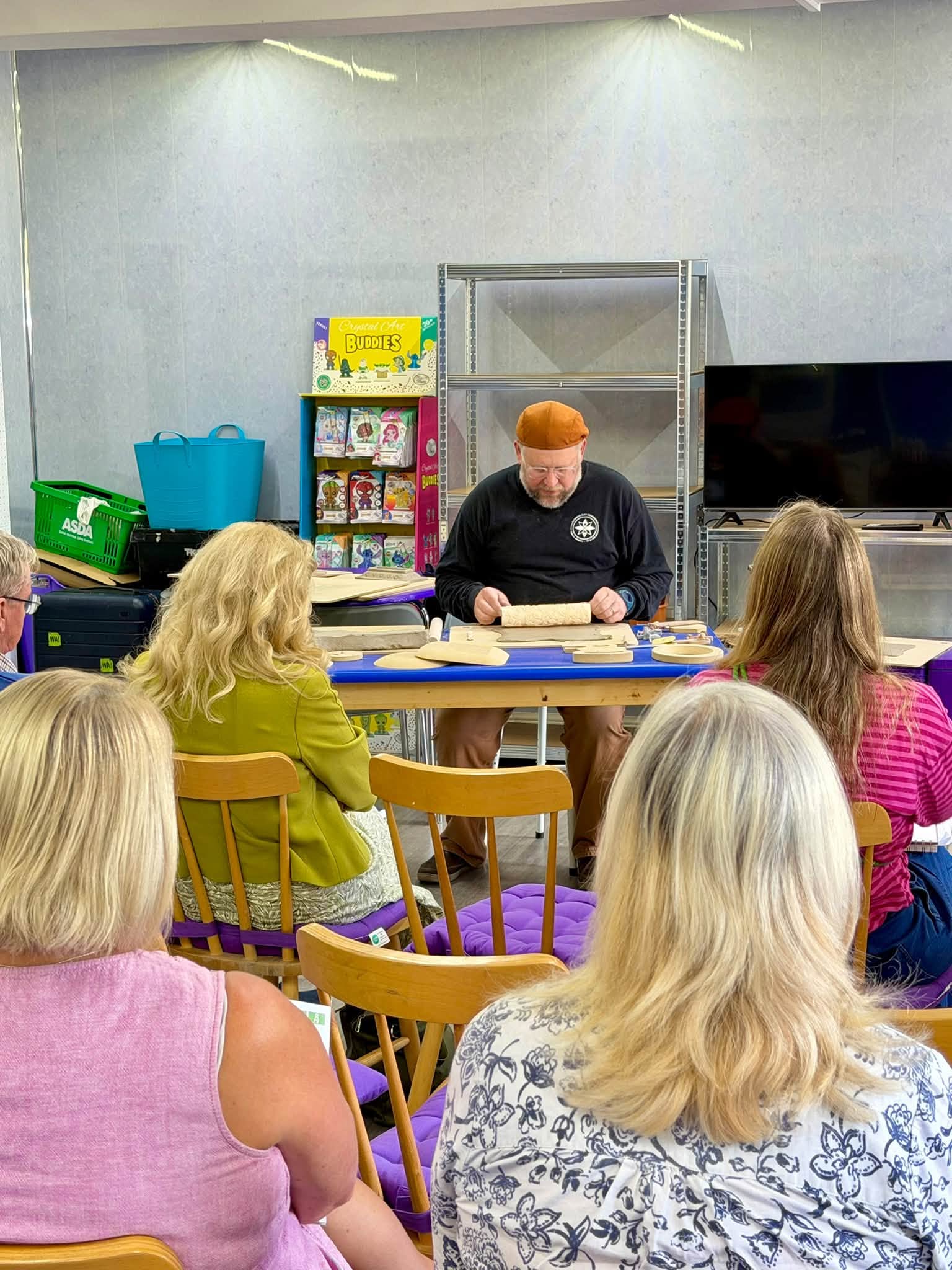 Jeff Rottman demonstrating clay forming techniques to attendees during the GR Pottery Forms event