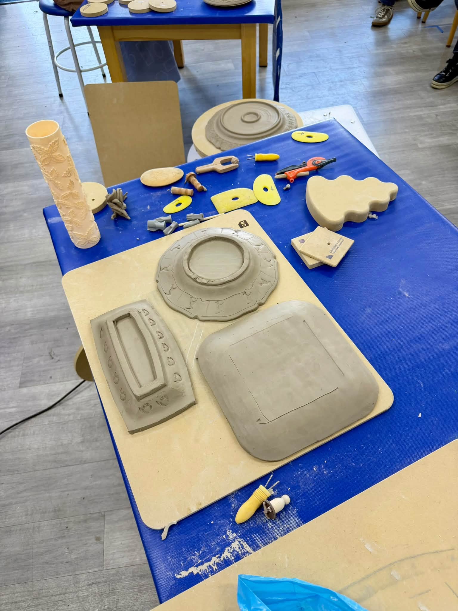 Selection of finished clay pieces, moulds and tools used with GR Pottery Forms