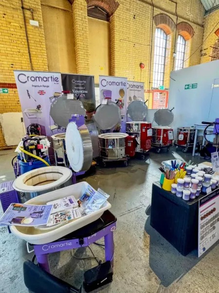 Cromartie stand at Sheffield Ceramics Festival 2025 showing kilns, glazes and pottery supplies