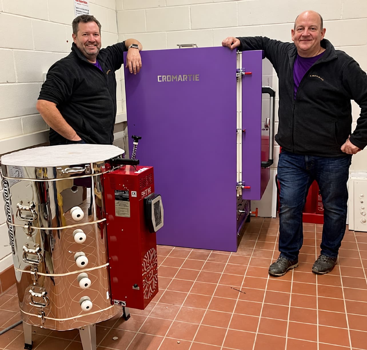 Cromartie engineers Simon and Mark alongside kilns in a kiln room